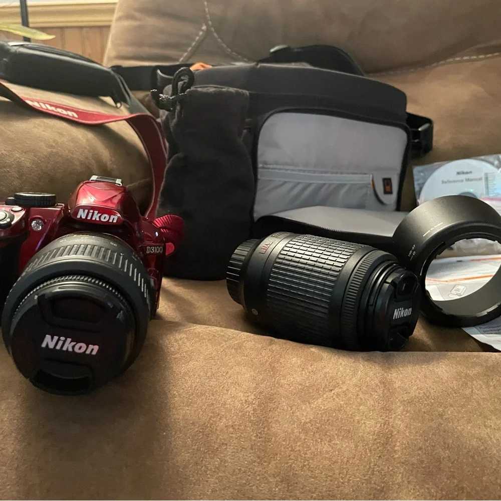 Cranberry Red Nikon digital camera with different size lense 2 battery w/charger